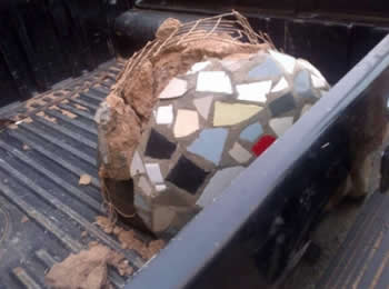 Box of sand and ceramic tiles